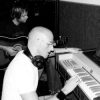 Sid at the optigan and Neil working out additional parts to some of the songs